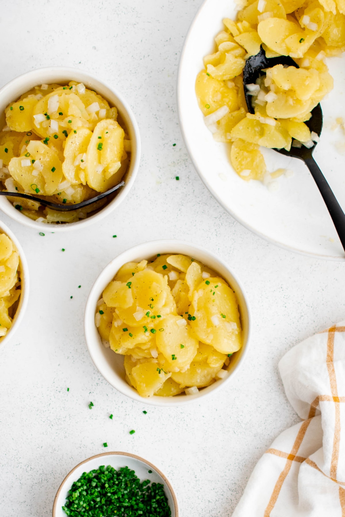 Small bowls of german potato salad.