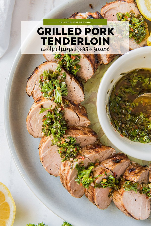 A pinterest friendly image of grilled pork tenderloin, sliced on a platter and drizzled with chimichurri sauce