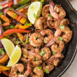 Social media image of pan filled with shrimp and peppers and onions