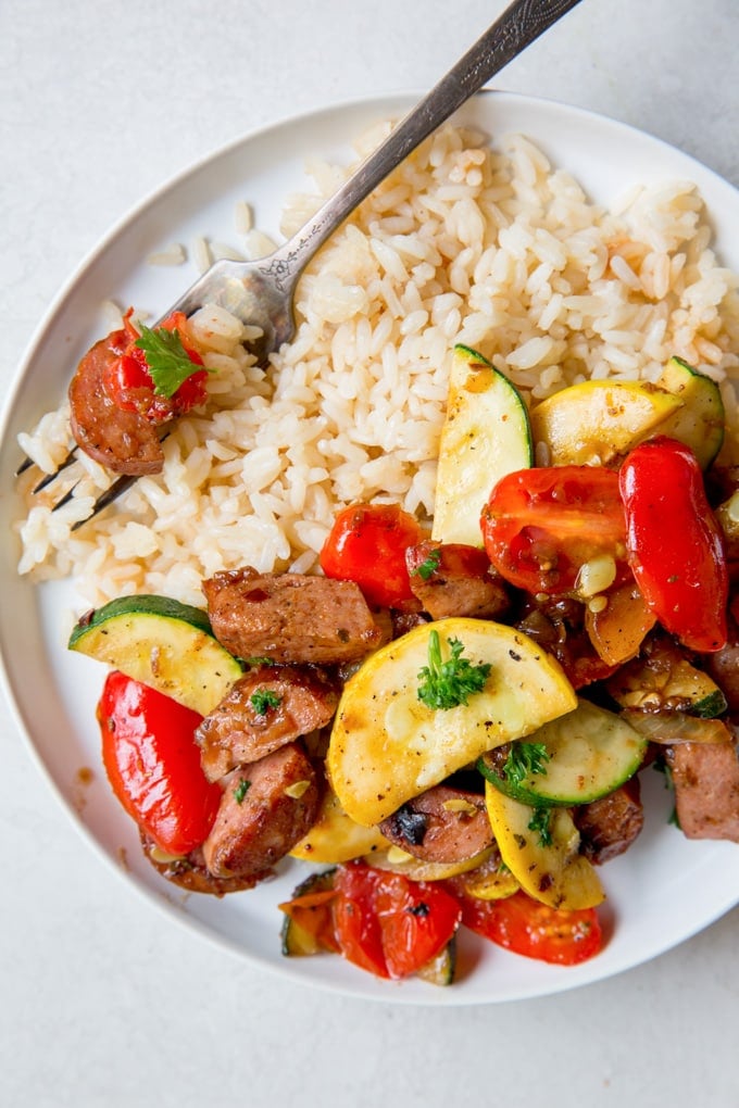 A plate of Rice, Sausage and Zucchini