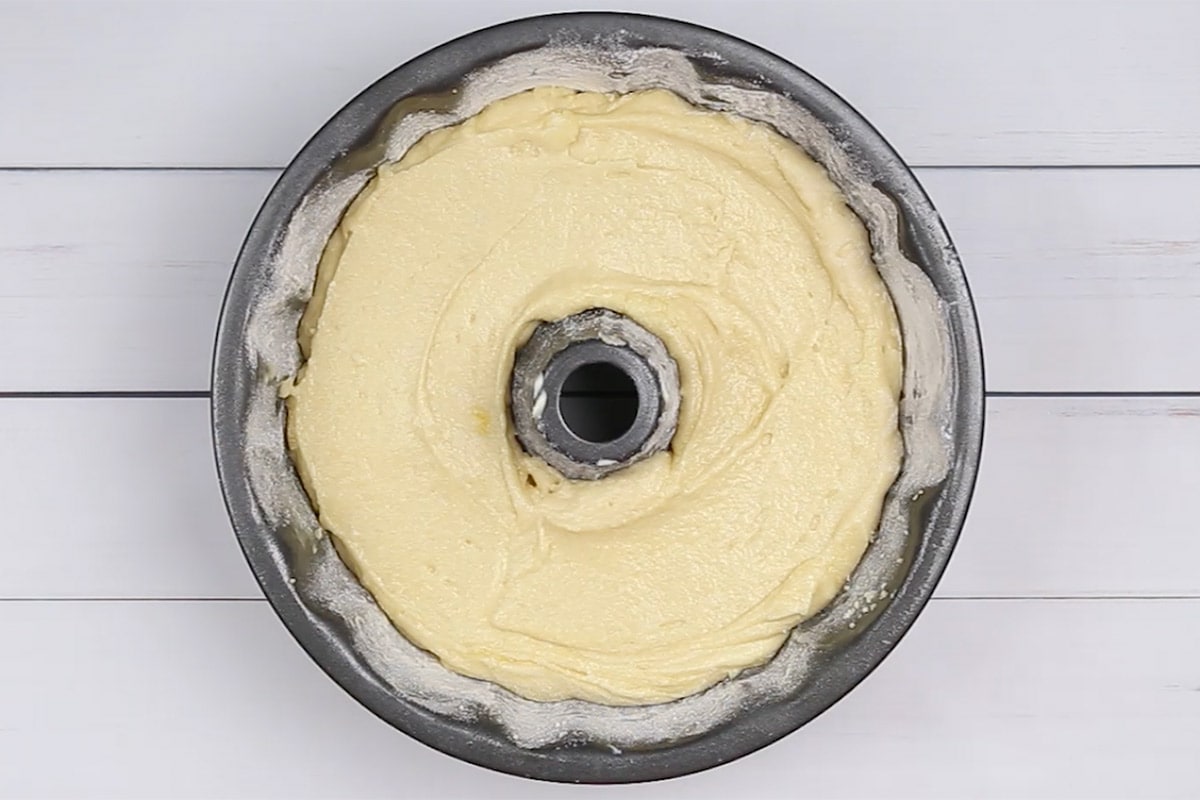 Cake batter in a floured bundt pan.