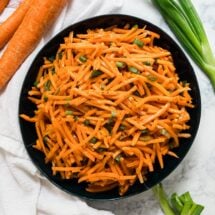 An overhead image of a bowl of carrot salad
