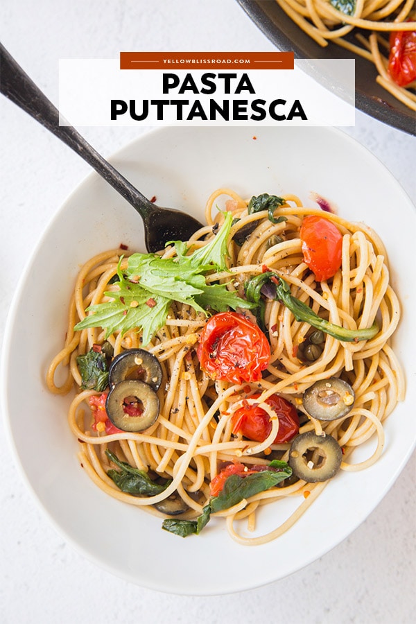 a bowl of pasta puttanesca with text over the photo