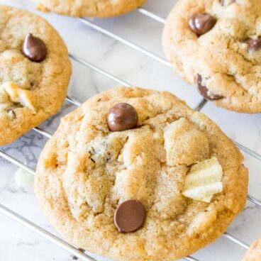 Potato chip cookies fresh from the oven cooling on a cooling rack.