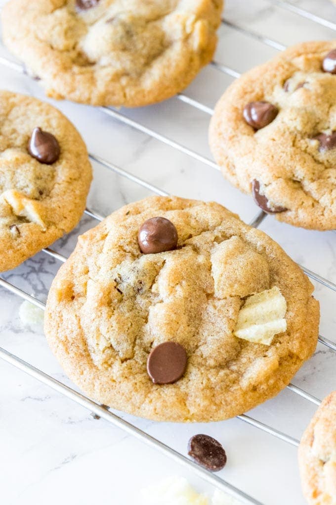 Potato chip cookies fresh from the oven cooling on a cooling rack.