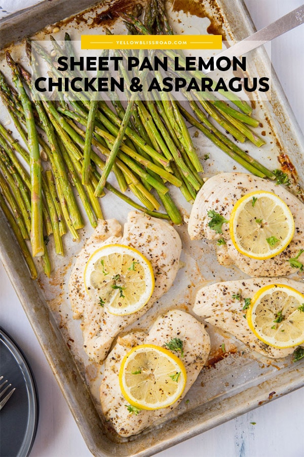 chicken with lemon slices and stalks of baked asparagus on a sheet pan with pinterest friendly title text.