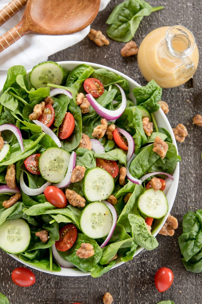 Spinach Salad with Red Wine Vinaigrette is the best weekday salad! It's easy and fast, made with fresh spinach, tomatoes, cucumbers and crunchy walnuts. Spinach salad with tomatoes, onions and cucumbers.