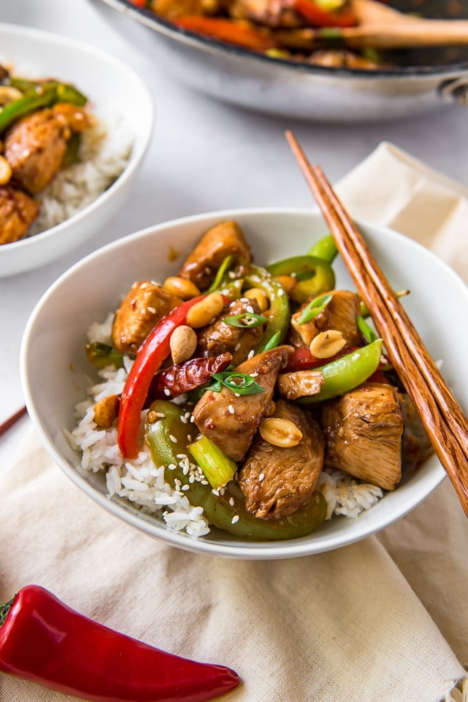 30-Minute Szechuan Chicken Stir Fry in a bowl with rice