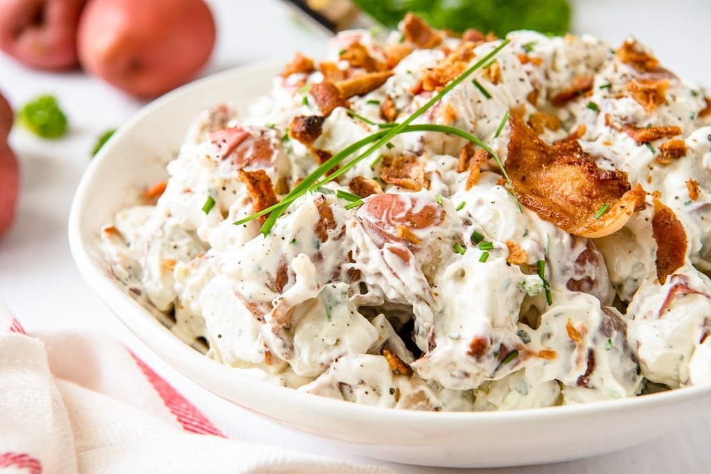 Bacon Ranch Red Potato Salad in a white bowl. 