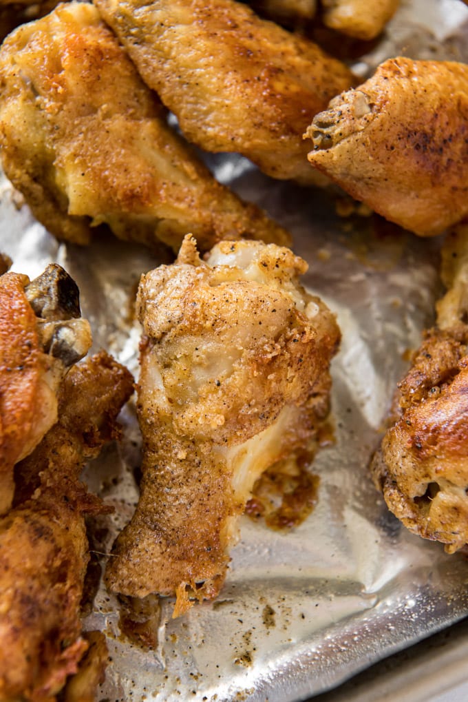 baked crispy wings on a baking sheet