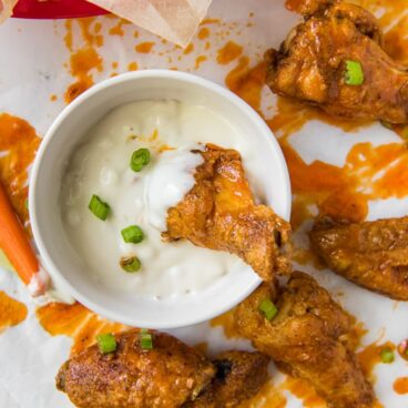 buffalo chicken wings oven white parchment paper, bowl of ranch dressing