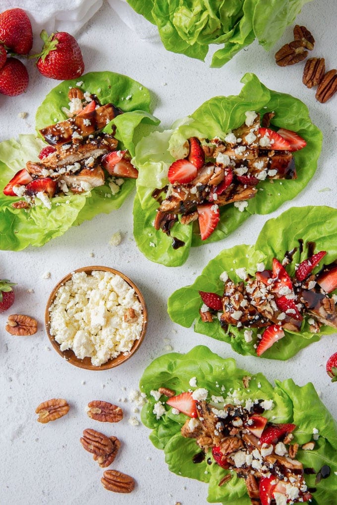 Grilled Balsamic Chicken in a tangy orange balsamic marinade with strawberries, pecans and Feta. These lettuce wraps are a light and filling summer meal. 4 lettuce wraps with balsamic chicken, feta cheese and pecans