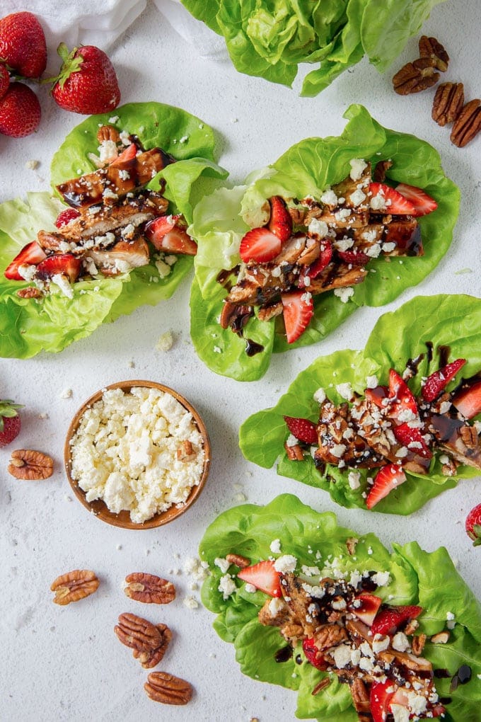 4 lettuce wraps with balsamic chicken, feta cheese and pecans