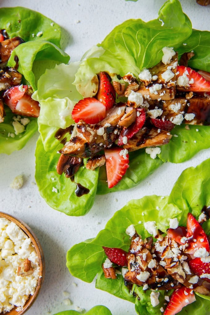 A close up image of a lettuce wrap filled with balsamic chicken