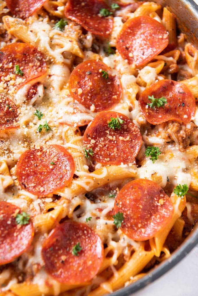 pepperoni, penne pasta, cheese, parsley in a large skillet