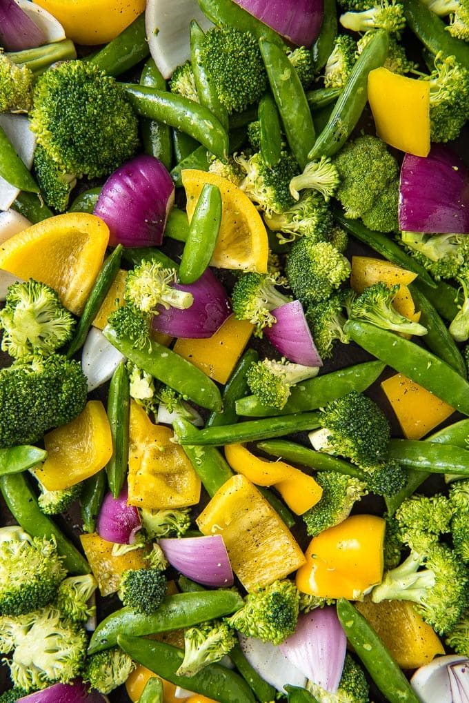 A sheet pan of colorful raw vegetabes