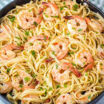 Shrimp Scampi is a classic dish loaded with garlic, butter, and sweet shrimp cooked to perfection. Serve over pasta for a quick and easy dinner you'll love!