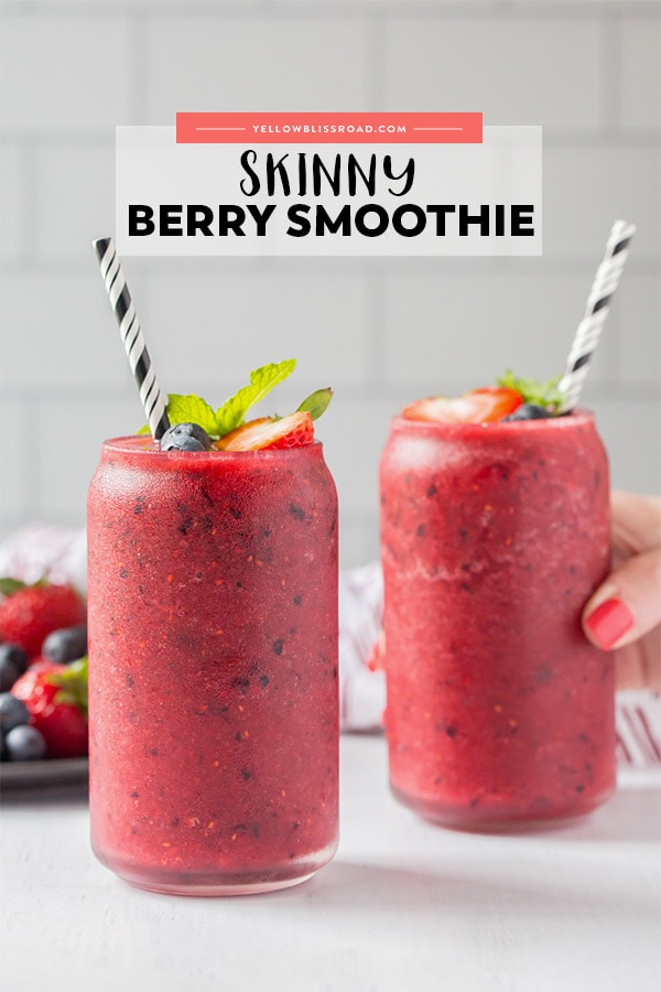 A hand reaching in to take a glass filled with a blended berry smoothie. Title text on the image for pinterest.