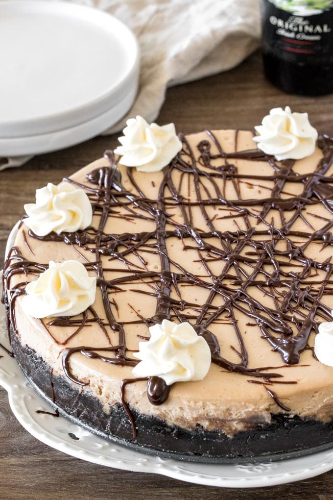 An entire Baileys cheesecake with Oreo crust and drizzle with chocolate sauce on top. 
