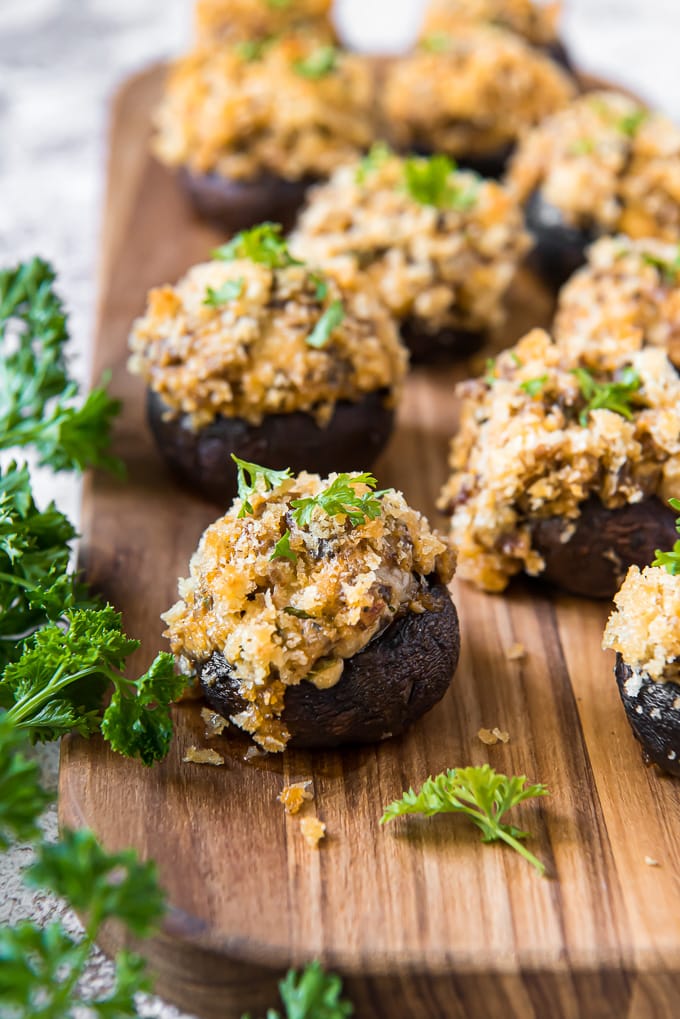 A dozen mushrooms stuffed with sausage and cheese filling.