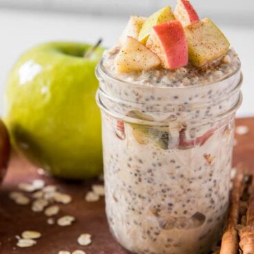 A jar filled with apple cinnamon overnight oats