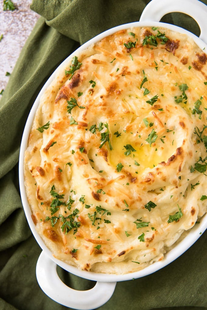 Cheesy Mashed Potatoes with chives on top.