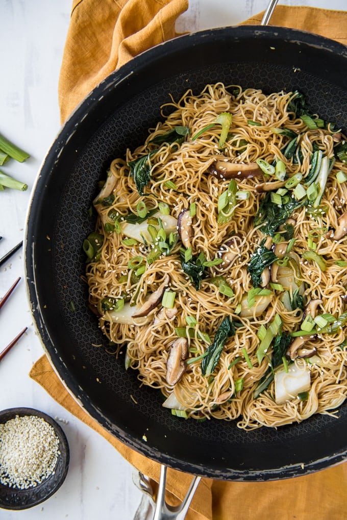 An overhead shot of vegetables and chow mein in a skillet