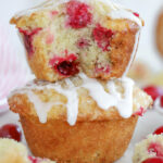 Two Cranberry Muffins stacked on top of each other.