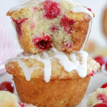 Two Cranberry Muffins stacked on top of each other.