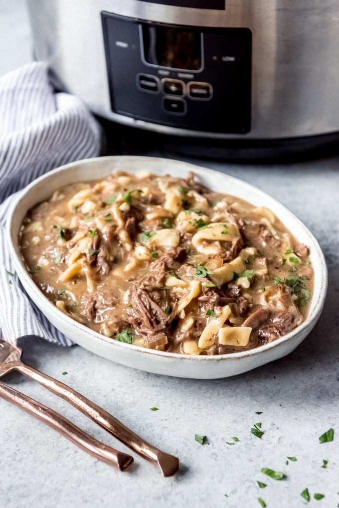 A bowl of beef and noodles made in the crockpot.