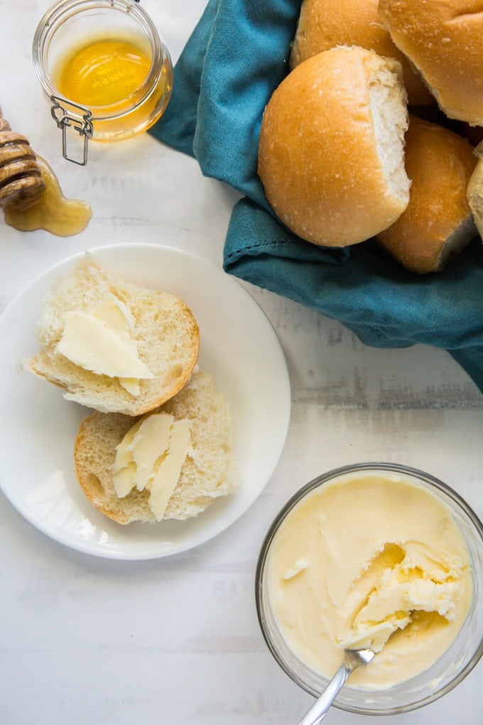 A plate of rolls with Butter