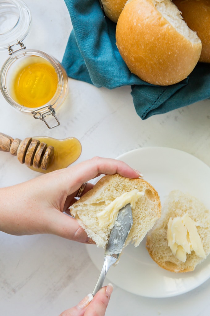 Buttering bread with honey