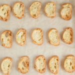 overhead image of sliced crostini on a tray