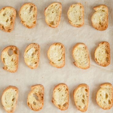 overhead image of sliced crostini on a tray