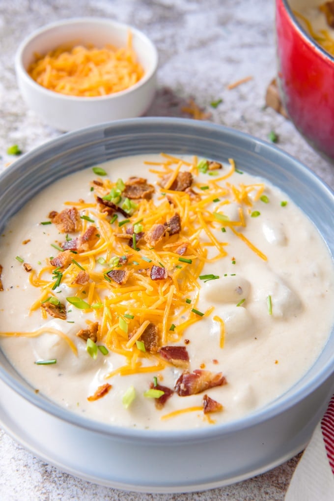 A close up of a bowl of potato soup