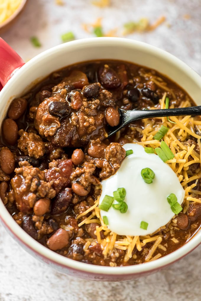 A spoonful of chili in the bowl