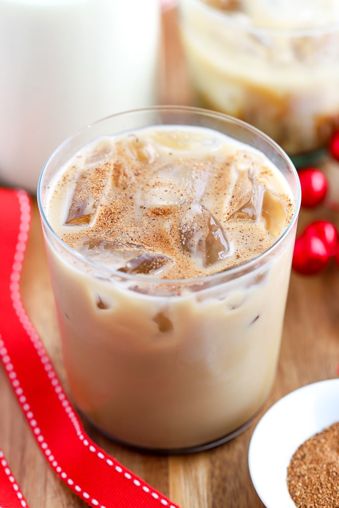 Eggnog White Russian Cocktail in an ice-filled glass topped with ground nutmeg.