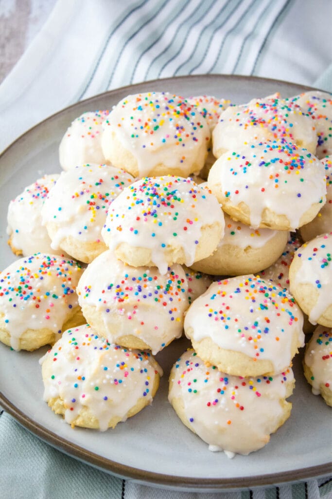 ricotta cookies piled up on a plate