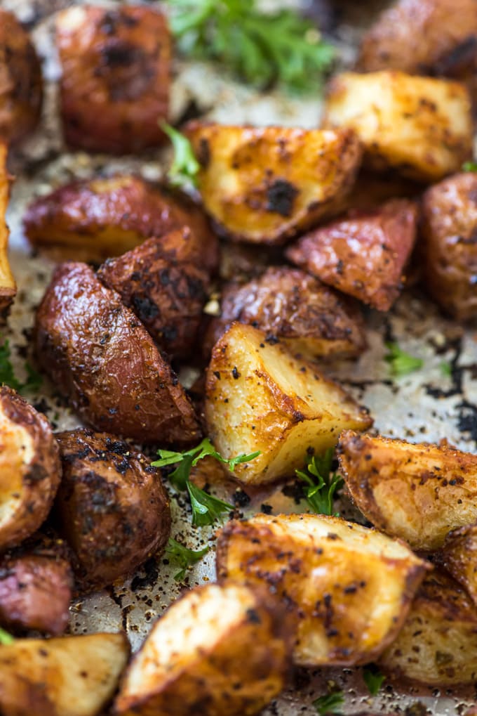 close up of diced red potatoes on a tray with parsley