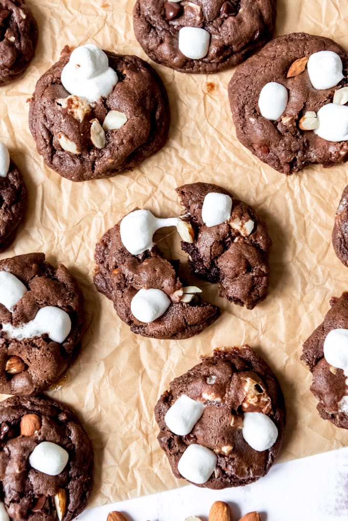 An image of soft rocky road chocolate cookies topped with marshmallows.