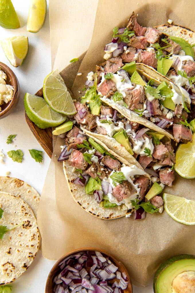 street tacos filled with skirt steak, avocado and other toppings