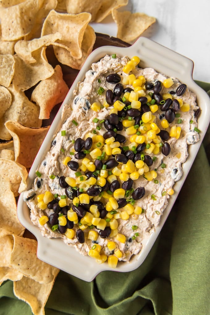 overhead shot of black bean and corn creamy dip and tortilla chips