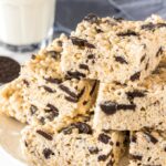 A plate of Oreo Rice Krispie treats stacked on a plate.