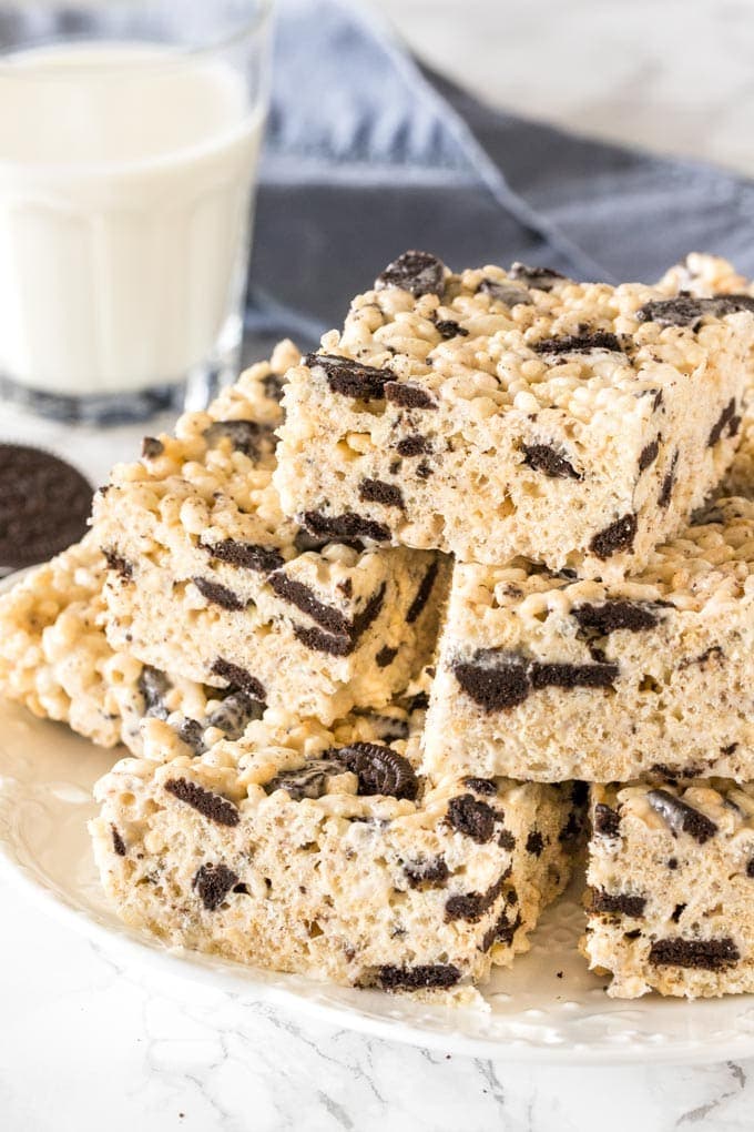 A plate of Oreo Rice Krispie treats stacked on a plate. 