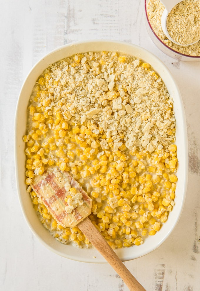 An overhead image of a casserole dish showing the layers in a corn casserole