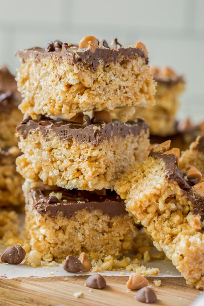a stck of three peanut butter krispie treats with chocolate on top