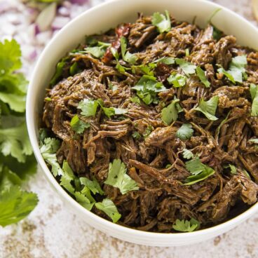 A bowl of shredded Barbacoa Beef