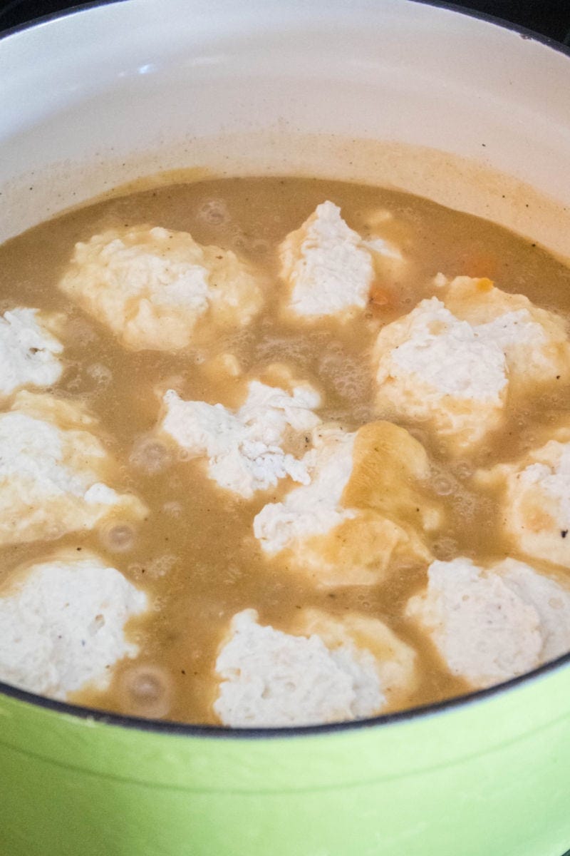 Chicken and Dumplings are a classic comfort food sure to satisfy your soul! Perfect for weeknight meals or Sunday supper with the family! dumpling dough floating in soup