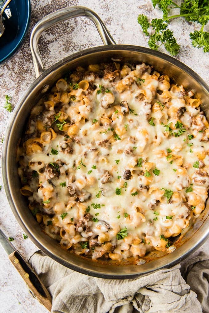 An overhead shot of a cheese covered hamburger casserole