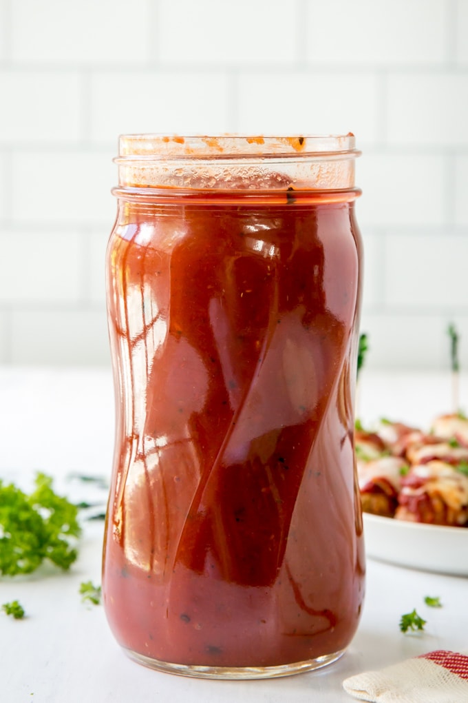 A jar filled with marinara sauce